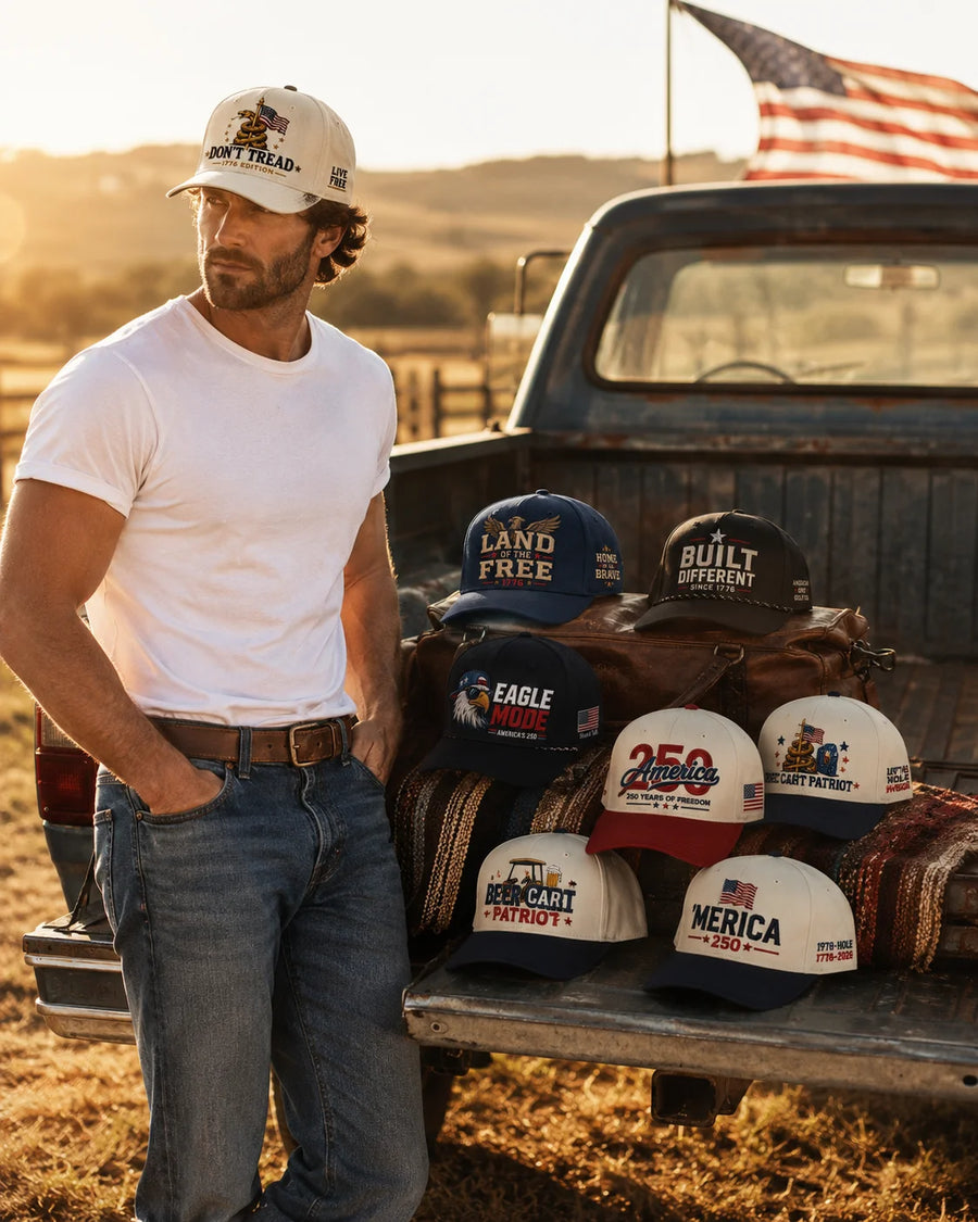 Man wearing True Glory patriotic hat leaning against pickup truck at golden hour sunset with American flag